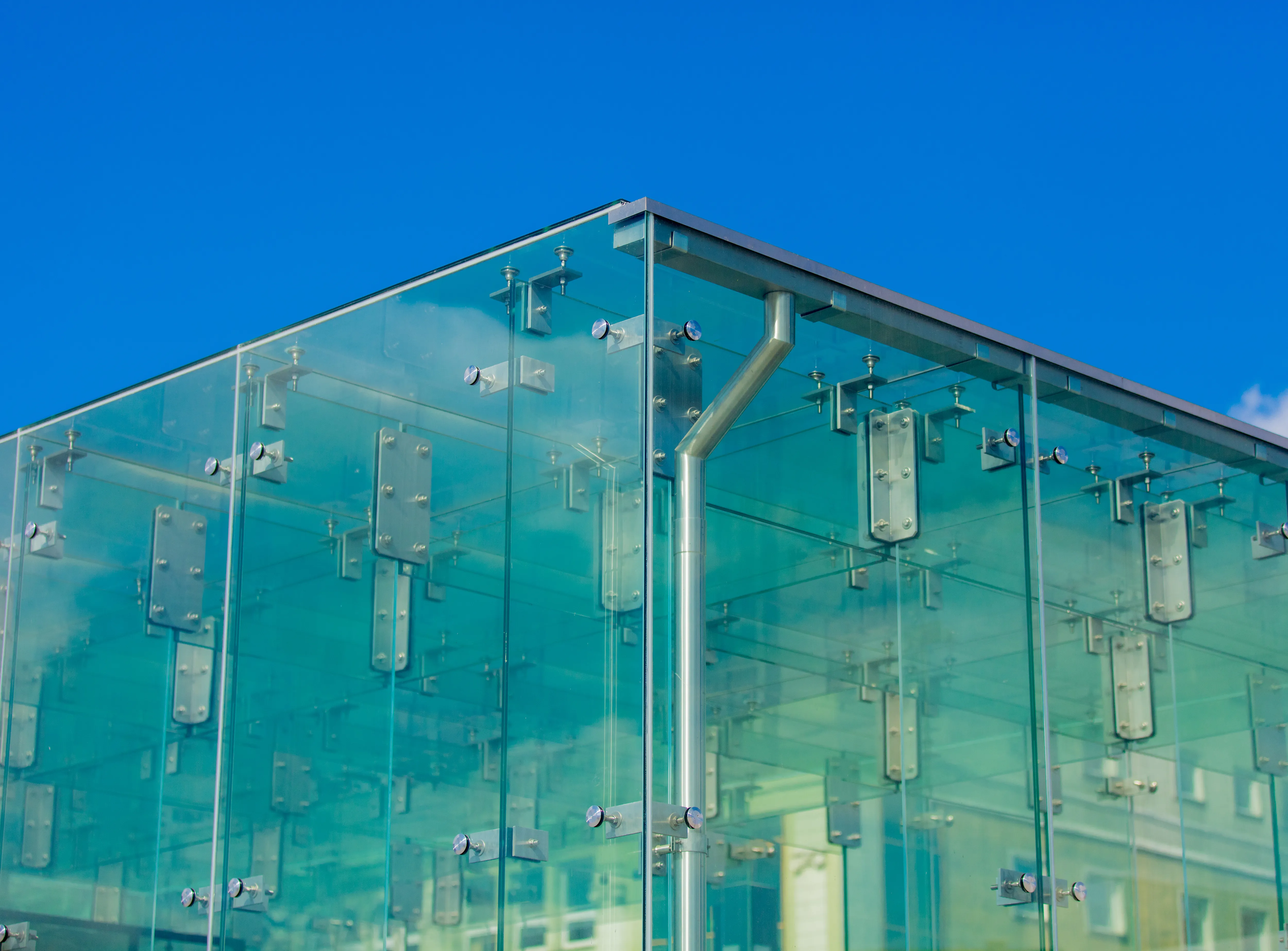 Closeup view on glass wall corner of a building